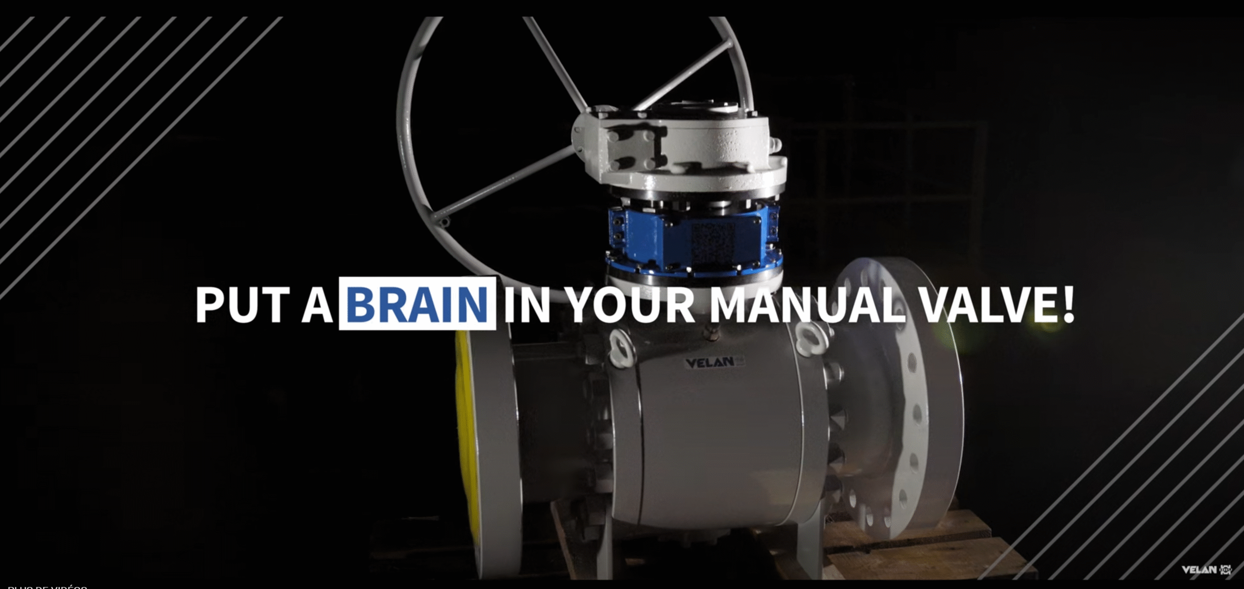 A large industrial valve with a handwheel is shown in a dimly lit setting. Overlaid text reads, "PUT A BRAIN IN YOUR MANUAL VALVE!" with the word "BRAIN" highlighted in blue.