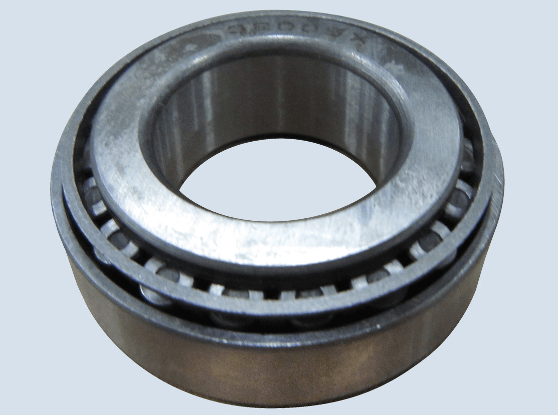 A close-up photo of a metal tapered roller bearing with visible rollers and an inner and outer ring, set against a light grey background.